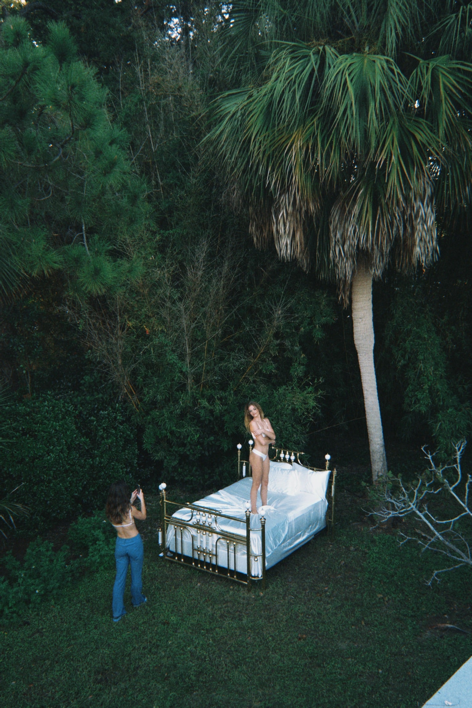 Picture of womens fashion model being photographed in luxury underwear.