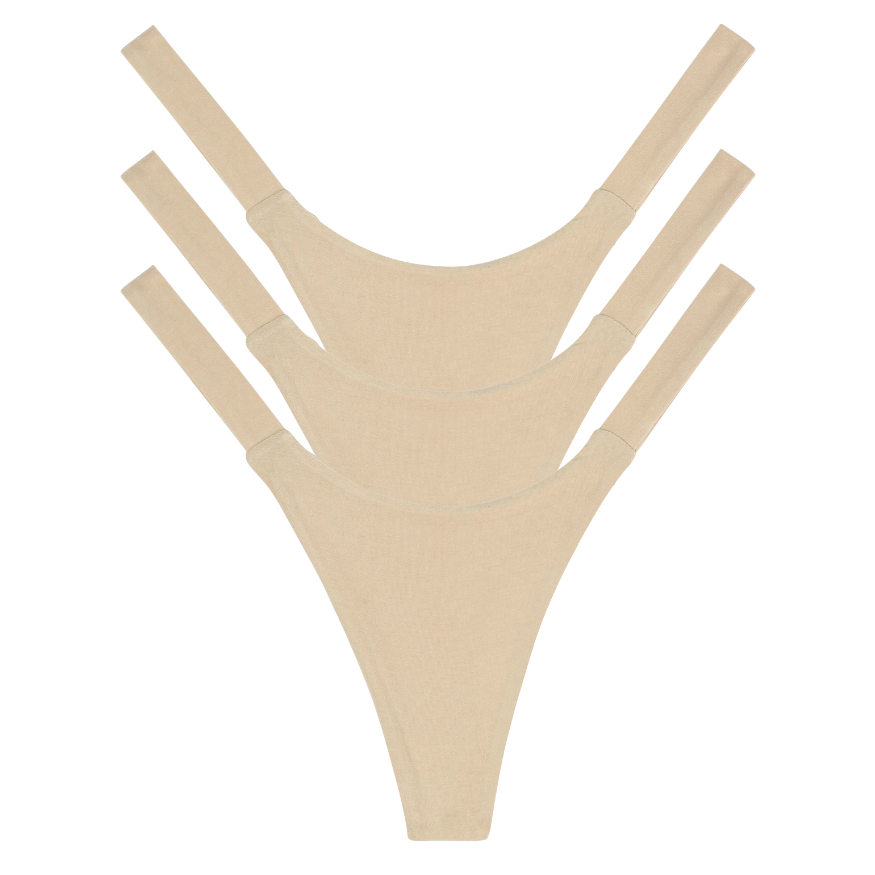 3 Beige thong undergarments on a white background