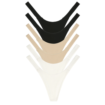 Set of black, beige, and white women's underwear on a white background